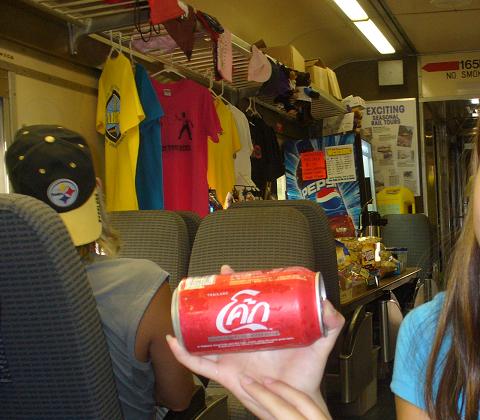 Coca-Cola TM  in Thai   are sold on the train .....